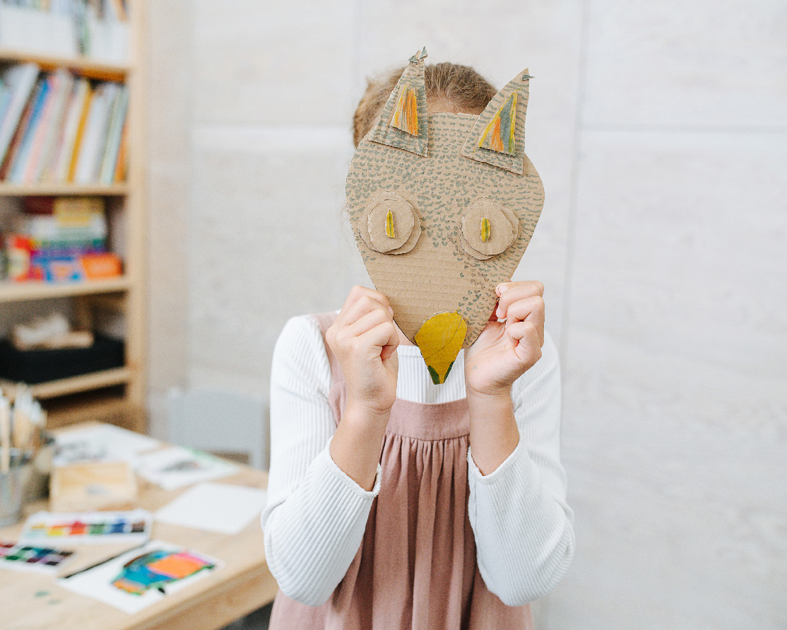 Mask on a little girl for creative arts therapy session online