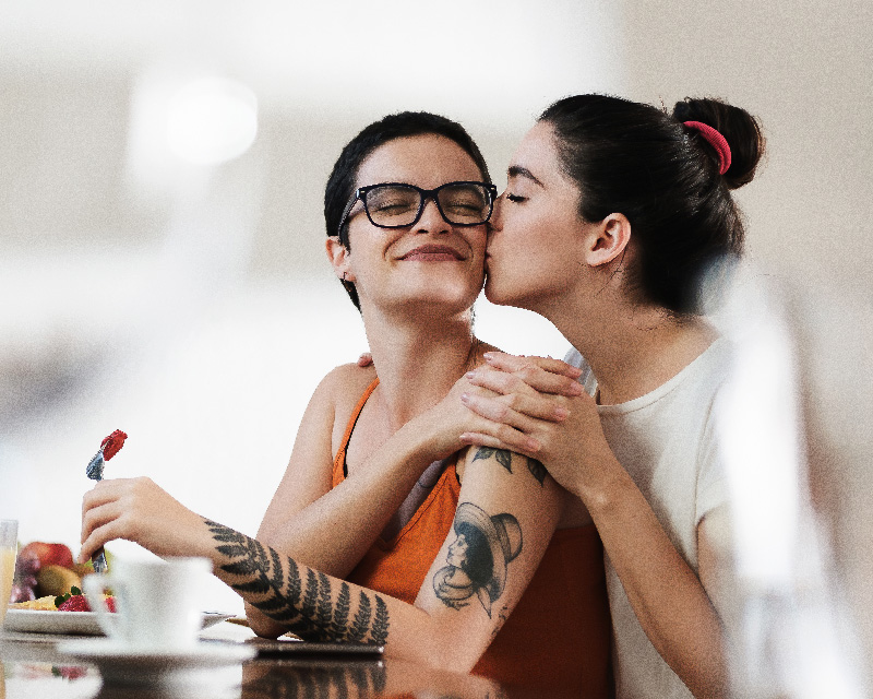 Lesbian couple successfully engaged in online therapy.