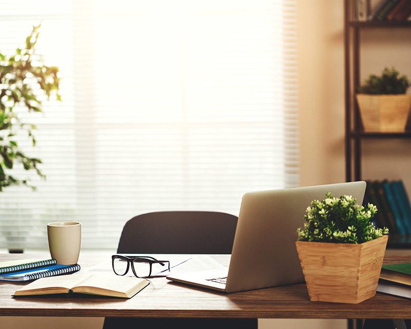 Office with a laptop on the desk ready for online therapy in New York